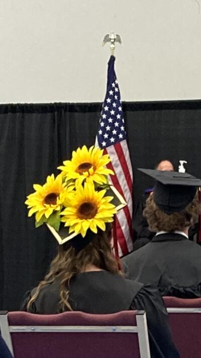 PTEC graduate cap with flowers 
